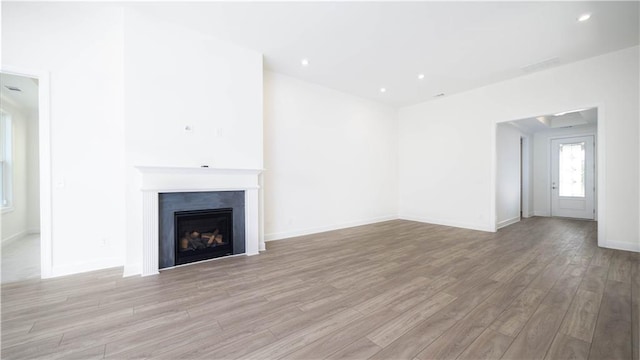 unfurnished living room with light hardwood / wood-style floors