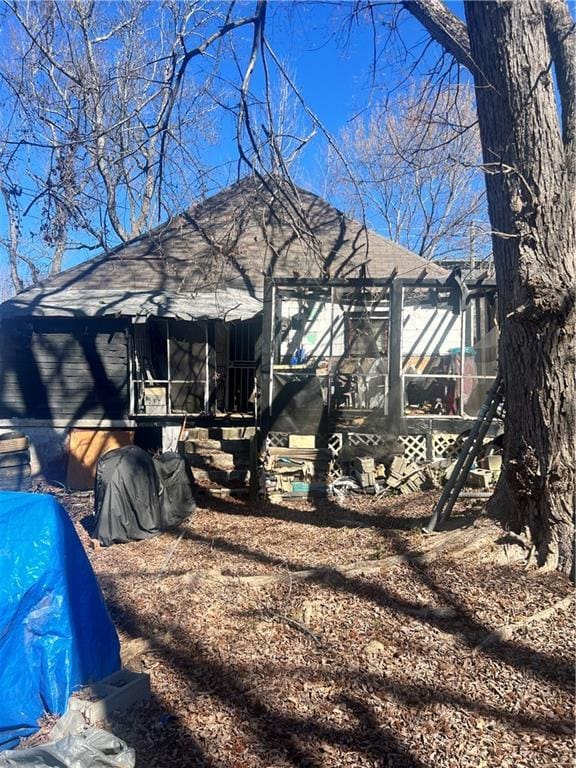 view of side of property featuring a sunroom