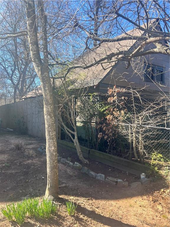 view of side of property with fence