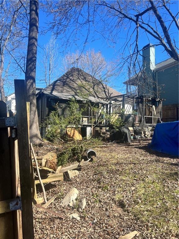 view of yard featuring a sunroom