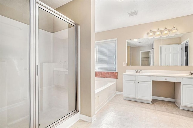 bathroom featuring vanity and separate shower and tub