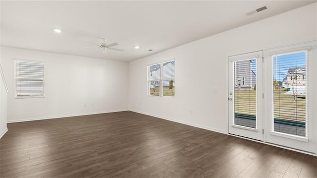 605 Lobelia Way, Locust Grove, GA 30248 - empty room with dark wood-style floors, ceiling fan, baseboards, and recessed lighting