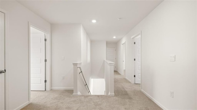 605 Lobelia Way, Locust Grove, GA 30248 - corridor featuring an upstairs landing, light carpet, recessed lighting, and baseboards
