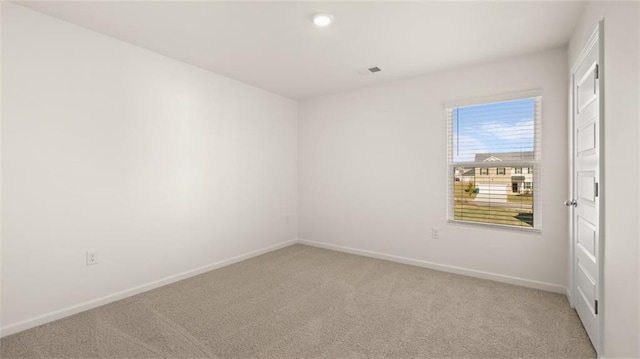 605 Lobelia Way, Locust Grove, GA 30248 - spare room featuring light carpet, baseboards, and recessed lighting