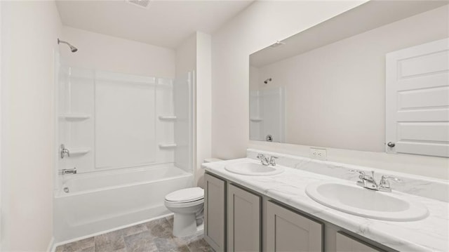 605 Lobelia Way, Locust Grove, GA 30248 - full bath with toilet, double vanity, bathing tub / shower combination, and stone finish floors