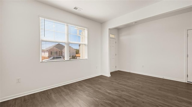 605 Lobelia Way, Locust Grove, GA 30248 - unfurnished bedroom featuring dark wood-style floors and baseboards
