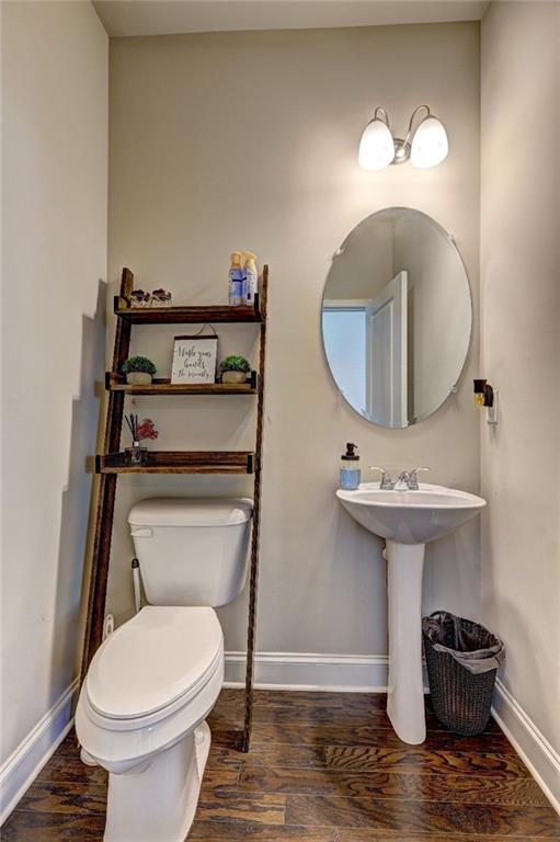 bathroom featuring baseboards and wood finished floors