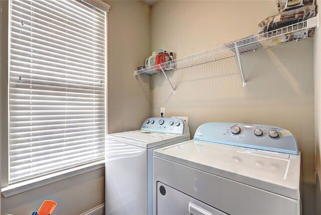 laundry area with washing machine and dryer and laundry area