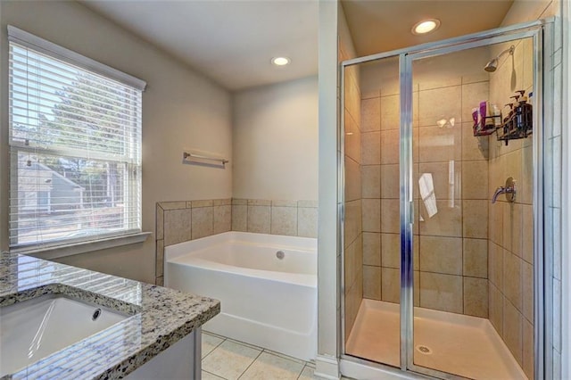 full bathroom with a shower stall, recessed lighting, vanity, tile patterned flooring, and a garden tub