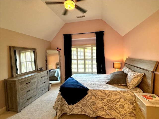 bedroom featuring vaulted ceiling, a ceiling fan, visible vents, and light colored carpet