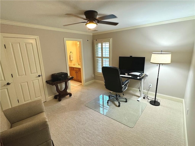 home office with light carpet, baseboards, ornamental molding, and a ceiling fan