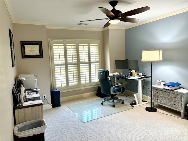 office area with ceiling fan, light colored carpet, visible vents, baseboards, and ornamental molding