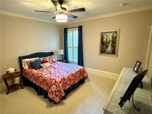 bedroom featuring carpet floors, crown molding, baseboards, and a ceiling fan