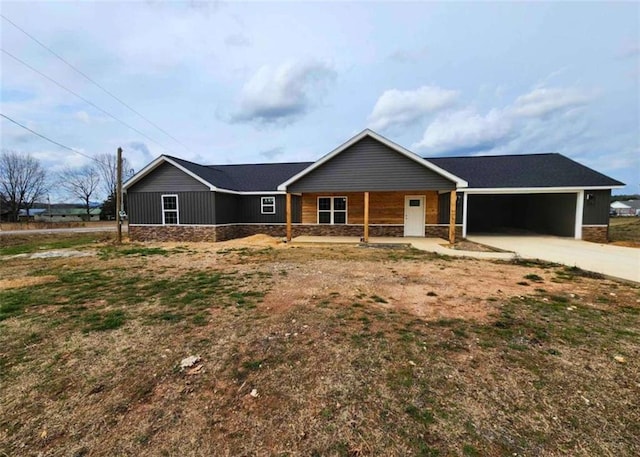 single story home with a porch and a garage