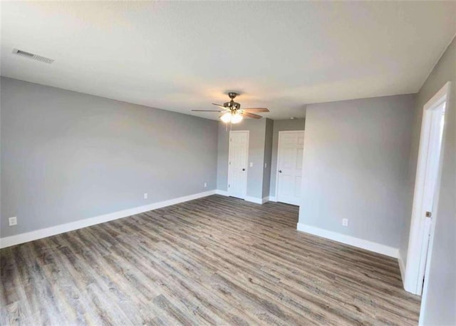 unfurnished room featuring hardwood / wood-style flooring and ceiling fan