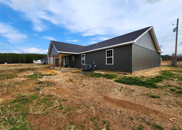 back of house featuring central air condition unit