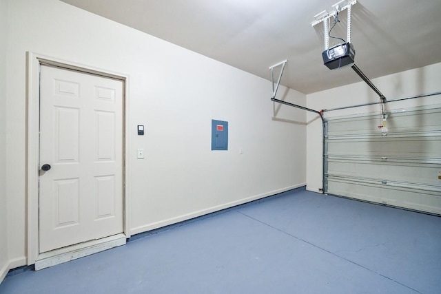 garage with electric panel, a garage door opener, and baseboards