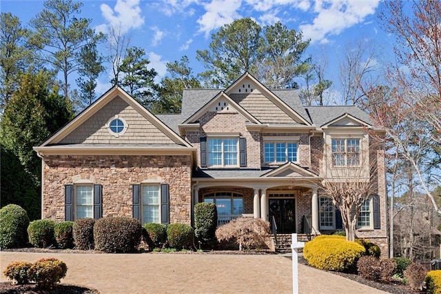 craftsman house with stone siding