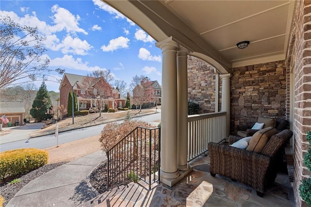 view of patio / terrace featuring a residential view and covered porch