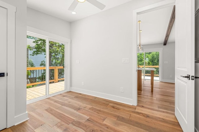 unfurnished room with recessed lighting, a ceiling fan, baseboards, light wood-type flooring, and beam ceiling