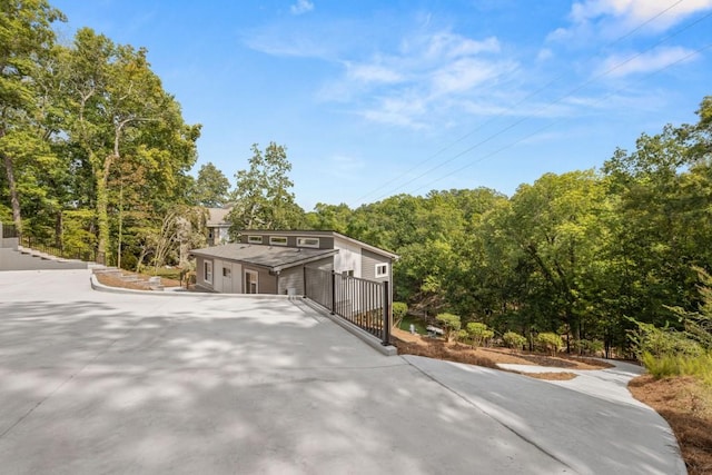 6564 Bermuda Ln, Flowery Branch, GA 30542 - view of front of property with view of wooded area and driveway