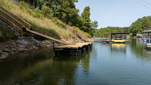 view of dock featuring a water view and stairway