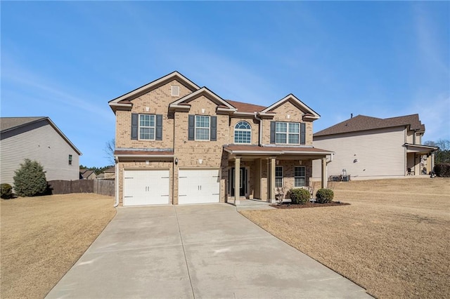 craftsman house with covered porch, a front yard, and a garage