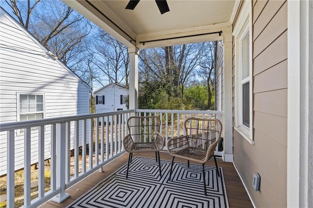 balcony featuring ceiling fan