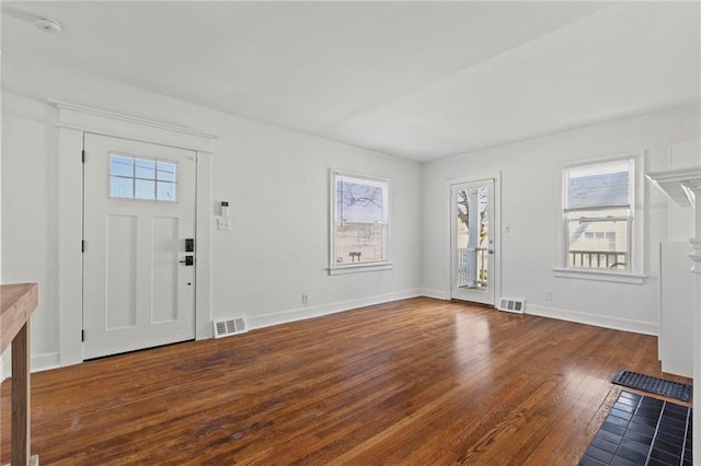 entrance foyer with plenty of natural light, wood-type flooring, and visible vents