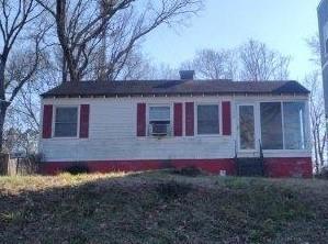 view of property exterior featuring a sunroom