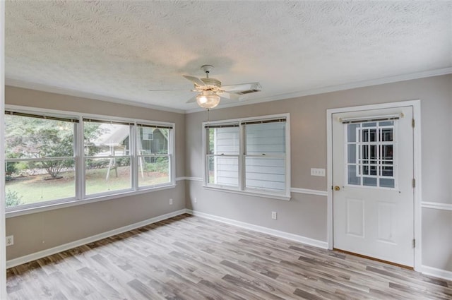 1980 Mcconnell Rd, Grayson, GA 30017 - unfurnished room featuring wood finished floors, a textured ceiling, ceiling fan, ornamental molding, and baseboards