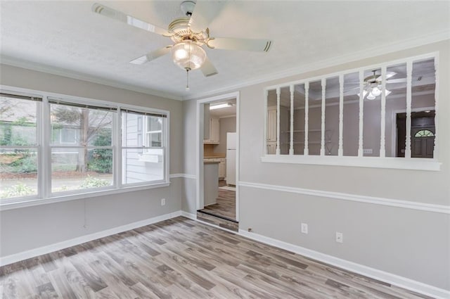 1980 Mcconnell Rd, Grayson, GA 30017 - empty room featuring wood finished floors, baseboards, ornamental molding, and ceiling fan