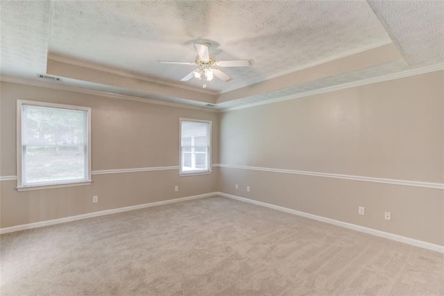 1980 Mcconnell Rd, Grayson, GA 30017 - unfurnished room with a tray ceiling, ornamental molding, a textured ceiling, a ceiling fan, and carpet
