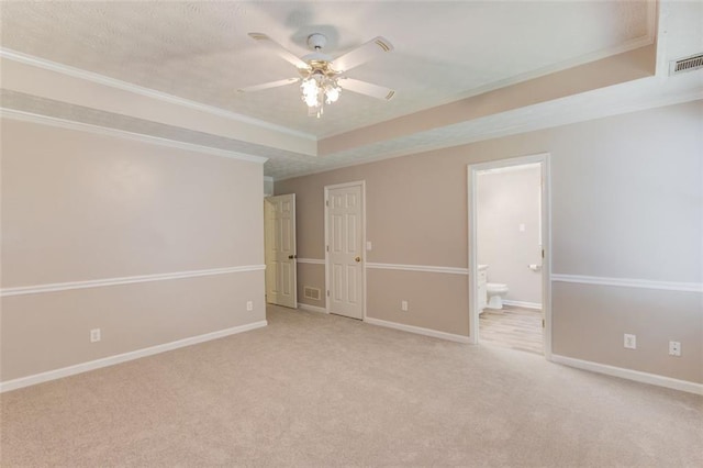 1980 Mcconnell Rd, Grayson, GA 30017 - unfurnished bedroom with crown molding, carpet, ensuite bathroom, a tray ceiling, and baseboards