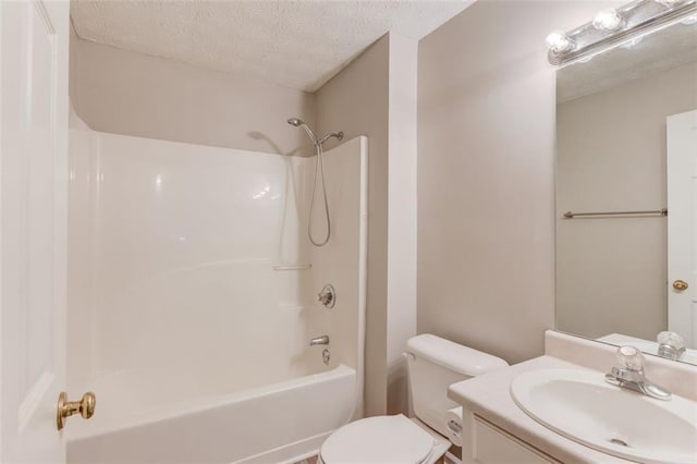 1980 Mcconnell Rd, Grayson, GA 30017 - bathroom featuring toilet, vanity, a textured ceiling, and tub / shower combination