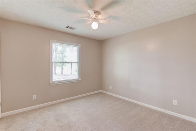 1980 Mcconnell Rd, Grayson, GA 30017 - unfurnished room featuring a ceiling fan, light carpet, a textured ceiling, and baseboards