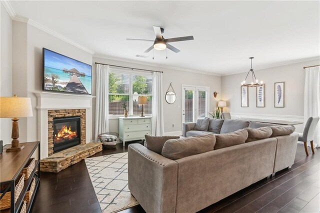 4020 Huron Dr, Cumming, GA 30028 - living room featuring a ceiling fan, recessed lighting, wood finished floors, crown molding, and a stone fireplace