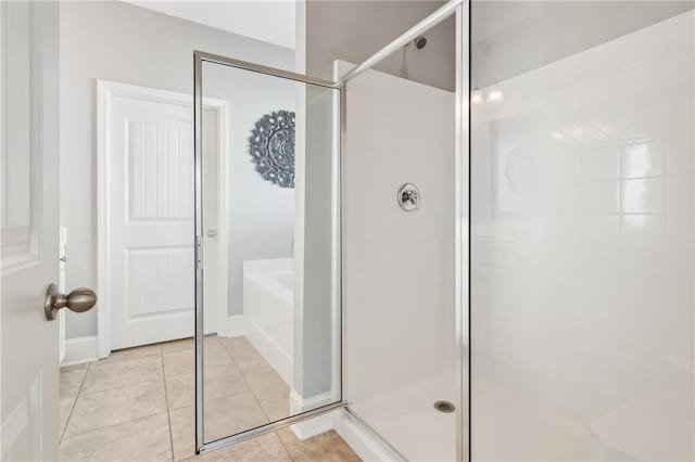 4020 Huron Dr, Cumming, GA 30028 - bathroom with a shower stall, a bath, and tile patterned floors