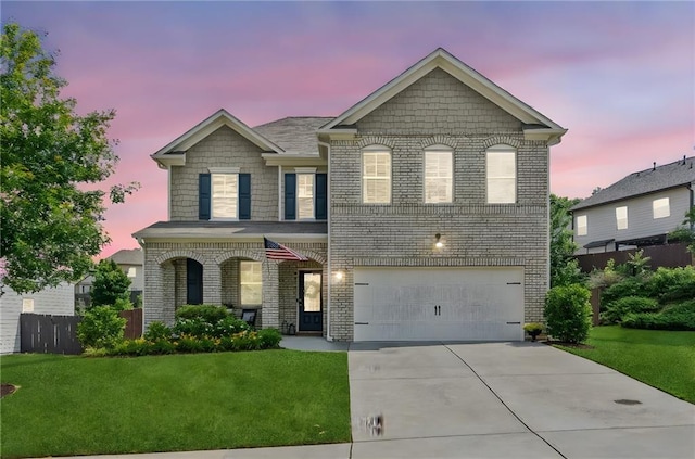 4020 Huron Dr, Cumming, GA 30028 - view of front of house with an attached garage, driveway, and brick siding