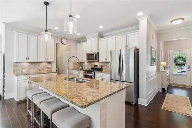 4020 Huron Dr, Cumming, GA 30028 - kitchen featuring stainless steel appliances, dark wood-type flooring, ornamental molding, white cabinets, and recessed lighting