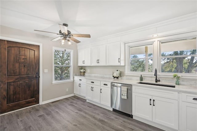 kitchen with dishwasher, ceiling fan, sink, white cabinetry, and hardwood / wood-style floors