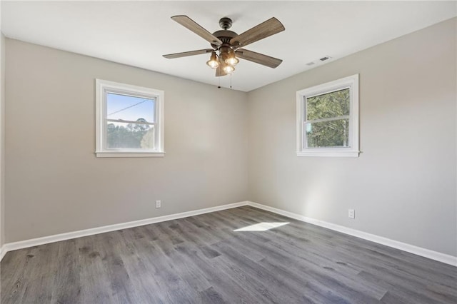 empty room featuring hardwood / wood-style flooring and ceiling fan