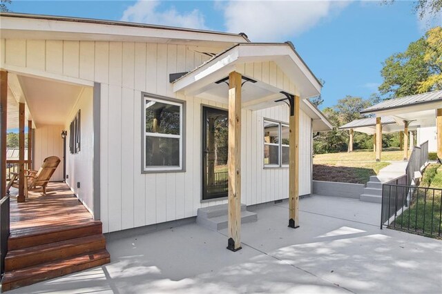 doorway to property featuring a patio