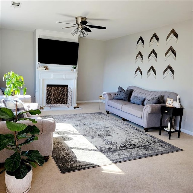 living room with carpet flooring and ceiling fan