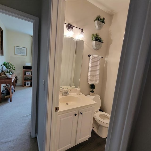 bathroom with vanity and toilet