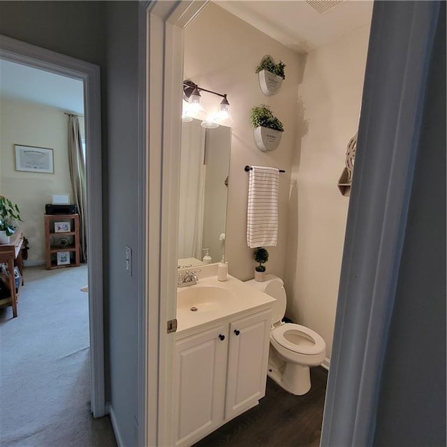 bathroom with vanity and toilet