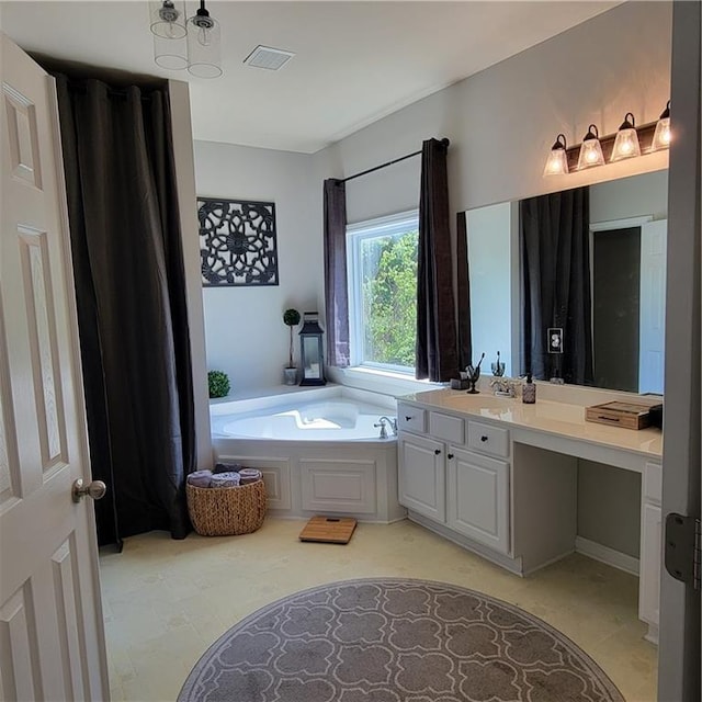 bathroom with vanity and a tub to relax in