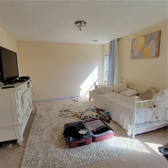 bedroom with light colored carpet