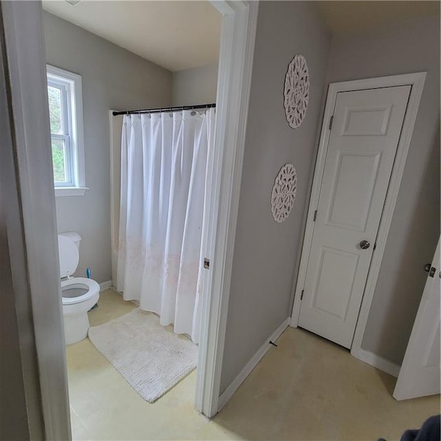 bathroom featuring toilet