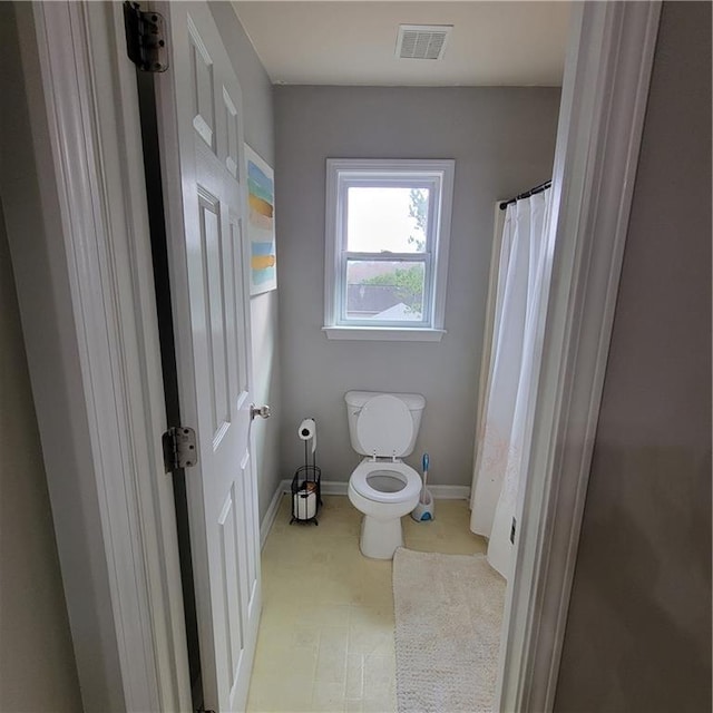 bathroom featuring toilet